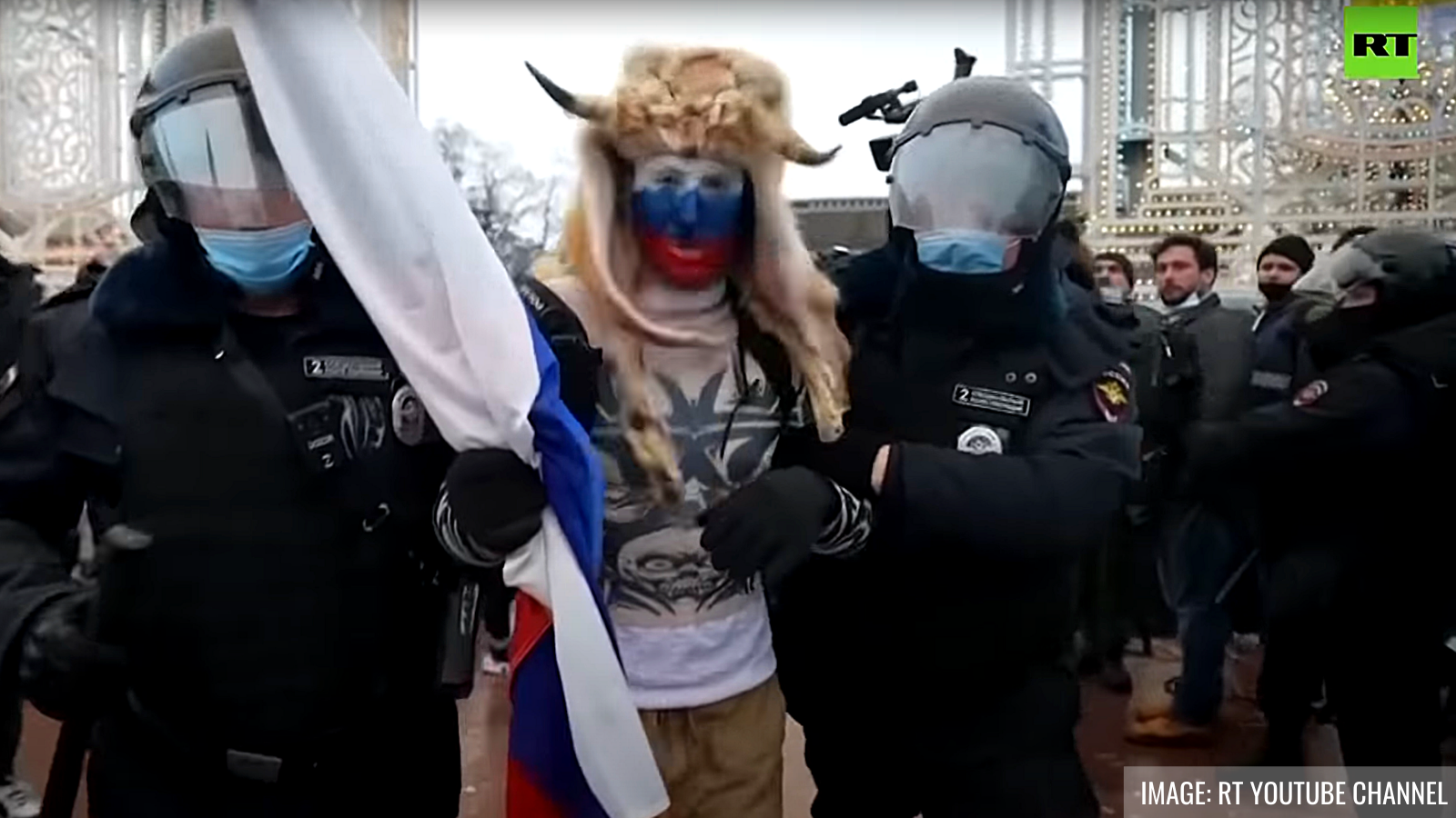 Detained protester in Moscow. Image: RT YouTube channel.